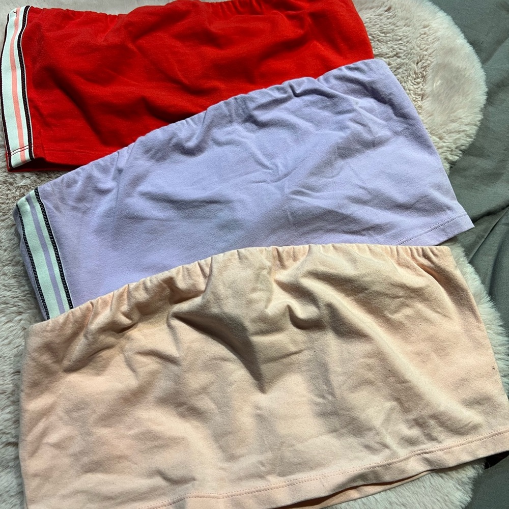 Aire, size XL (colors Purple & Peach) size L ( color Red)